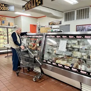 a woman pushing a shopping cart