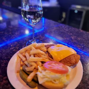 a plate of food and a glass of wine