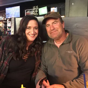 a man and a woman sitting at a table