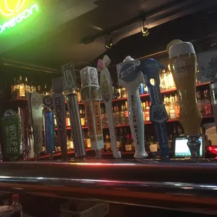 a row of beer taps
