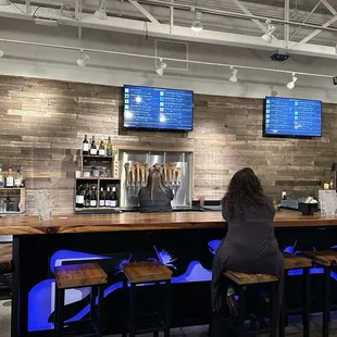 a woman sitting at the bar