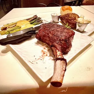 40oz Tomahawk Rib Steak, Grilled Asparagus and Baked Potato.