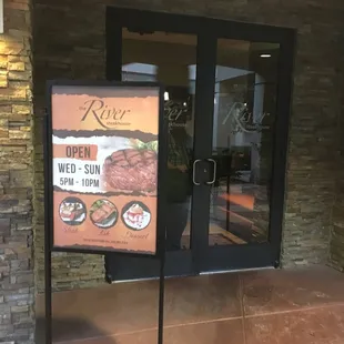 Hours and specials posted outside entrance