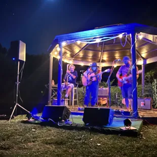 a band performing in a gazebo