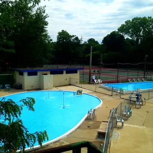 Two kids' pools and outdoor family bathroom.
