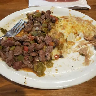 Steak Ranchero with an enchilada and beans