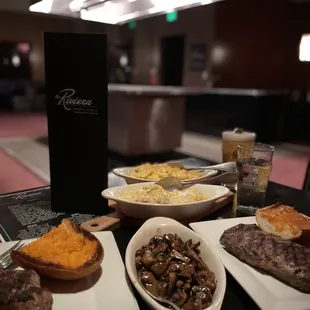 Filet mignon, chipotle garlic bread, sautéed mushrooms, cowboy stake, baked macaroni and cheese, Potato au Gratin