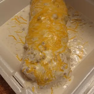Country gravy on a breakfast burrito