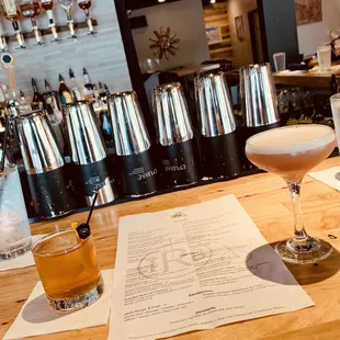 a cocktail and a menu