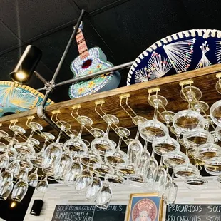 wine glasses hanging from the ceiling