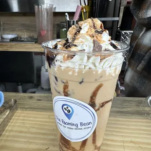 an iced coffee with whipped cream and chocolate