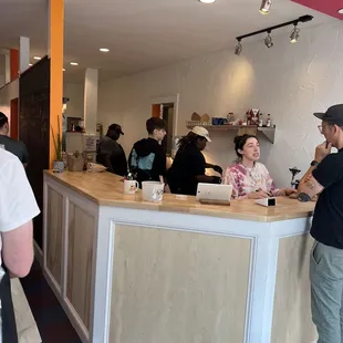 a group of people at a counter