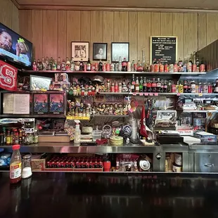 Counter seating view of original owners (pictured at top) and nostalgic knick knacks (great way to keep kids occupied)