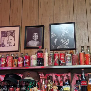 a shelf of coca colas