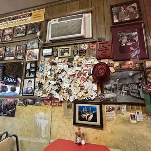 Wall opposite counter with table seating pictured