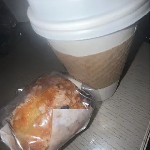 a bagel and a coffee cup