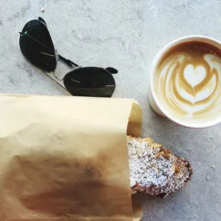 a cup of coffee and a paper bag