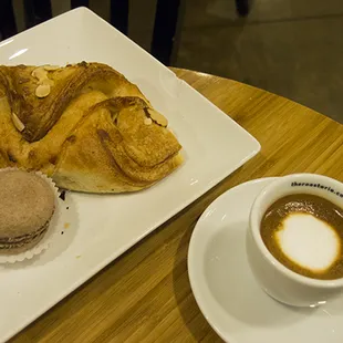 The almond croissant and macaron are OK.  The espresso is very good: it's a bright flavor profile.