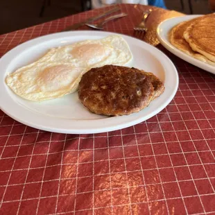 Eggs over easy and two sausage patties that came with 2 large pancakes.