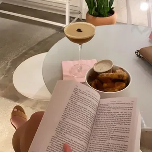 Espresso martini, truffle fries, and a good book in this super cute cafe