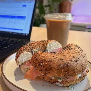 Iced latte with almond milk, salmon bagel