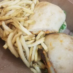 Grilled chicken on ciabatta. Side of fries with sprigs of rosemary