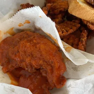 Buffalo chicken tenders with sweet potato waffle fries.