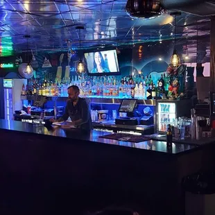 a man standing at a bar