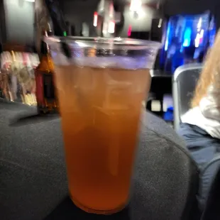 a glass of iced tea on a table