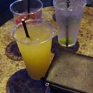 a table with drinks and a wallet