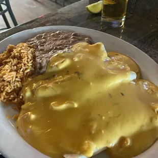 Enchilada plate smothered in queso