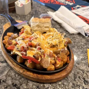 The Rock Skillet add 4- roasted red peppers, cheese, bacon, sausage , biscuit!