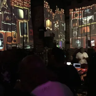 a crowd of people watching a video