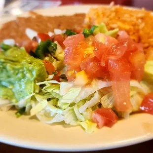 This comes along with the chicken and beef fajitas, and sausage. Rice and beans, guacamole, and a side of lettuce and tomatoes.