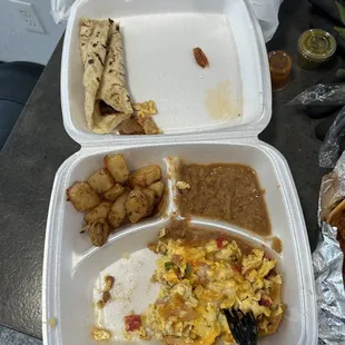 a meal in a styrofoam container