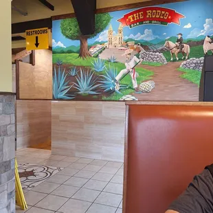 a man sitting in a booth