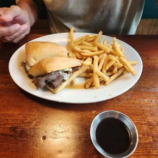 a plate of french fries and a sandwich