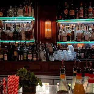 a bar with many bottles of alcohol