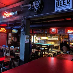 a bar with neon signs