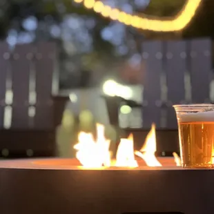  glass of beer on a fire pit