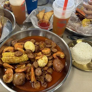 Shrimp Headless sausage eggs potatoes  corn side of white rice