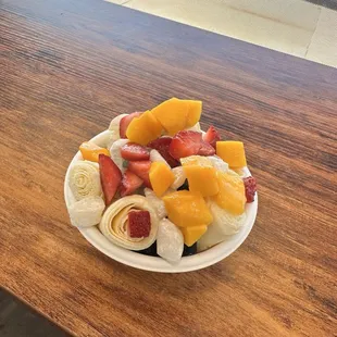 Mango ice cream roll with fresh fruits, mochi, boba and lychee jelly