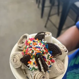 Cookies and cream, whip cream, oreos, rainbow sprinkles