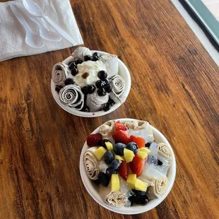 Left: cookies and cream icecream with boba and whipped cream  Right:  coffee icecream with boba, whipped cream, fruit and lychee jelly