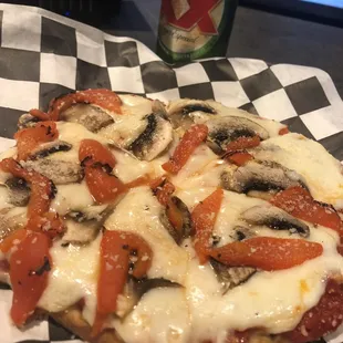 Appetizer pizza with mushrooms and roasted red peppers