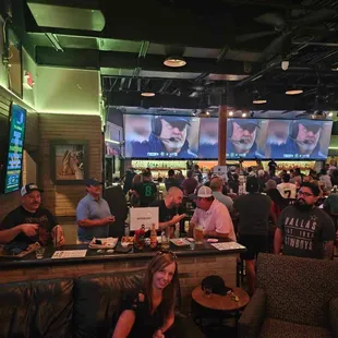 people sitting at the bar