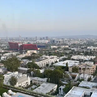 a view of a pool and a city