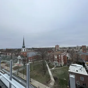 a view of a city with a steeple