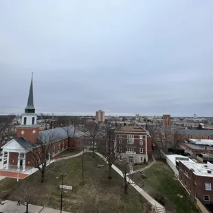 a view of a city with a steeple