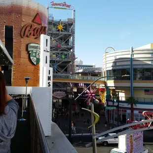 a woman taking a picture of a carnival